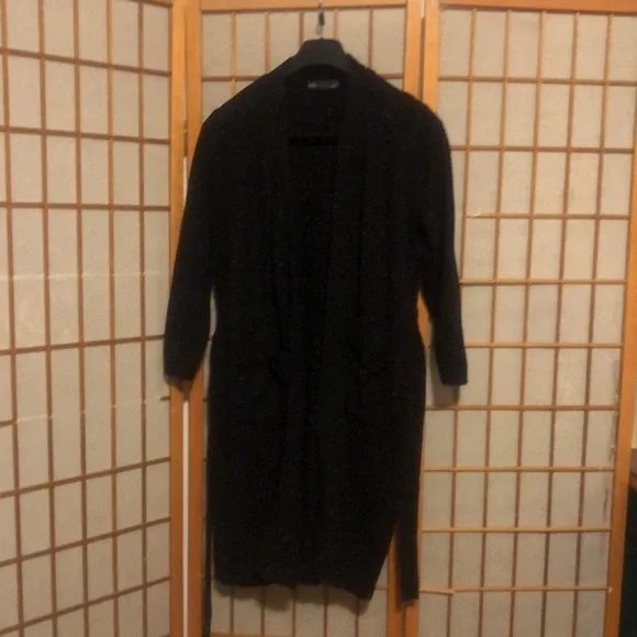 Long sweater jacket with belt.  Black with a few colored fabric spots. - Picture 2 of 7